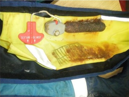 Life jacket ruined by rusty cylinder